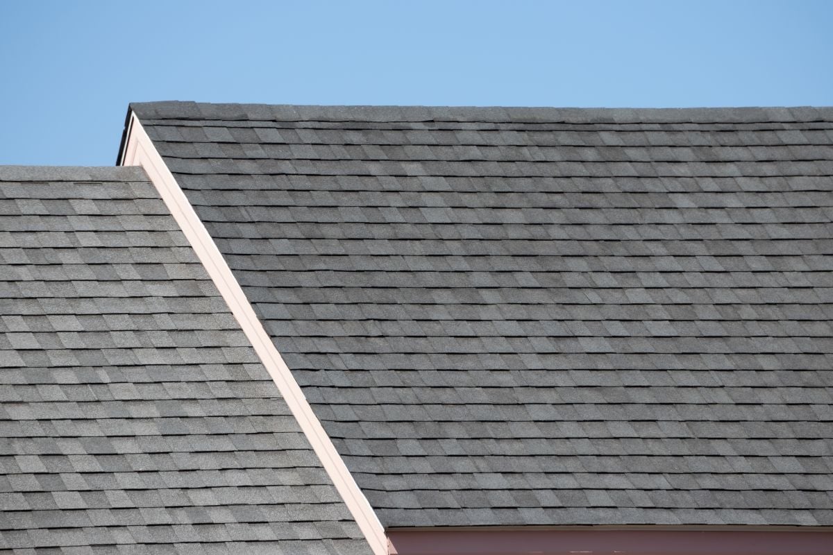 Roof shingles on top of the house against blue sky