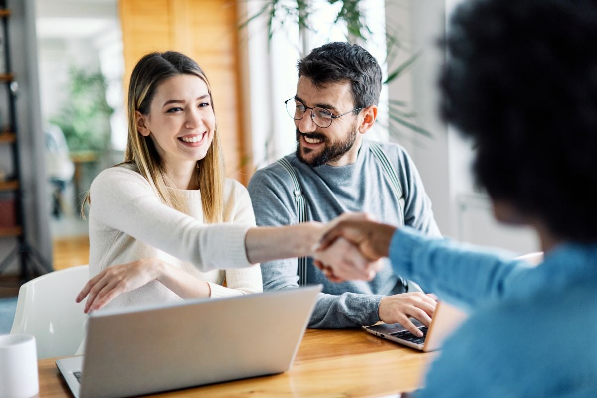 young couple shaking hand